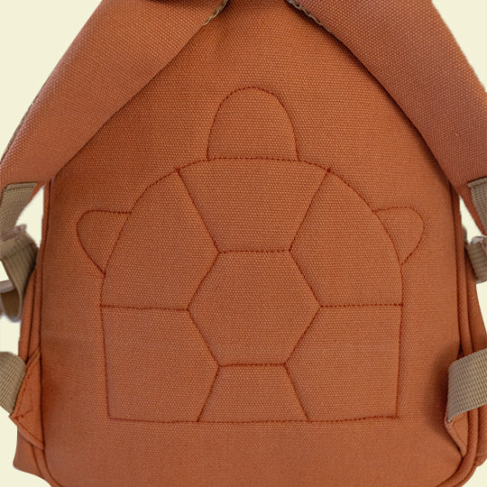 Bright orange children’s mini backpack with a stitched Pachee logo on the back, perfect for kids. Available online at Pachee.