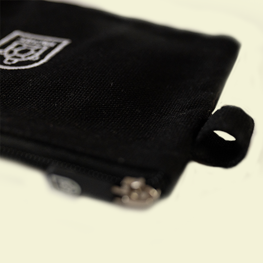 Black pouches with a side holder, available at Pachee's online store in the UK, perfect for storing small essentials.