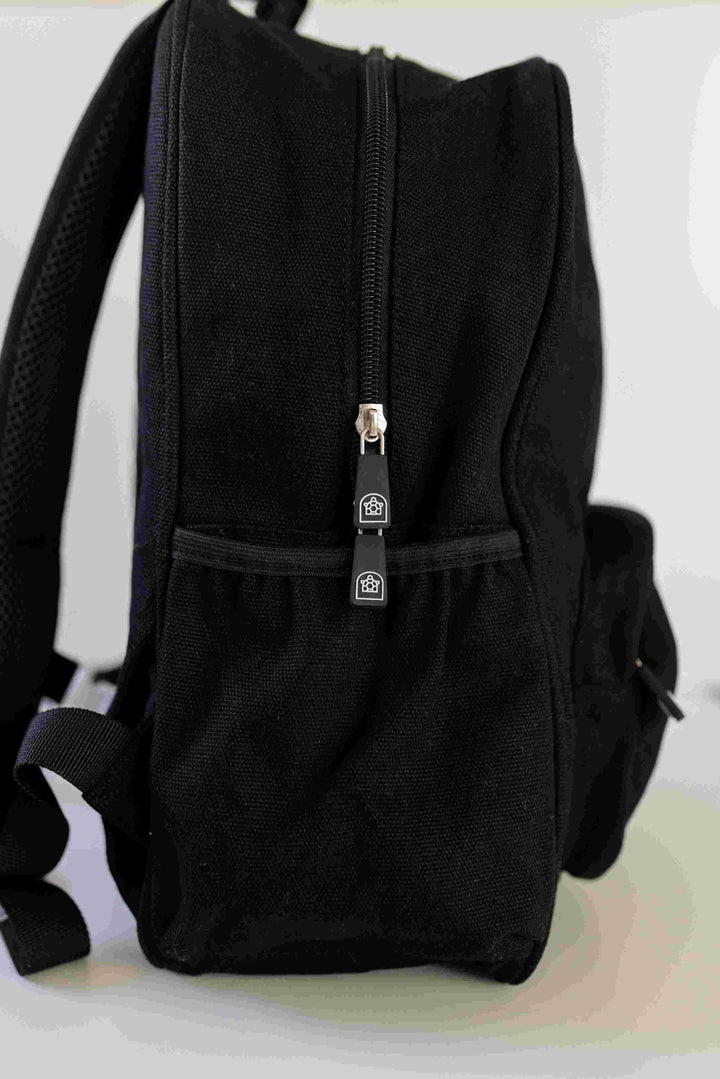 Junior backpack showcasing its size with a convenient bottle holder, perfect for kids, available at Pachee online store.
