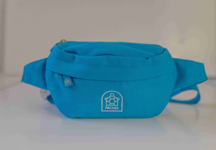 Close-up view of a blue bum bag for kids with a centered zipper, smooth material, and perfect stitching.