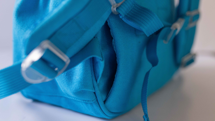 Blue junior backpack featuring a laptop/iPad pocket, ideal for students, available at Pachee online store.