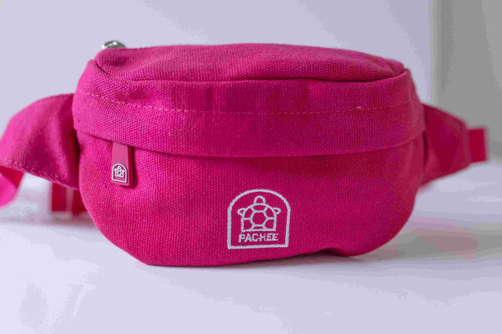 Close-up of a pink crossbody bum bag for kids featuring the Pachee logo prominently printed on the front.