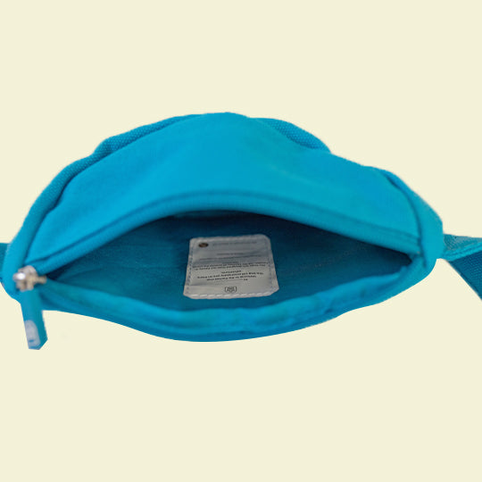 Blue canvas cotton bum bag with a spacious main compartment, featuring name and contact detail tag for easy identification.