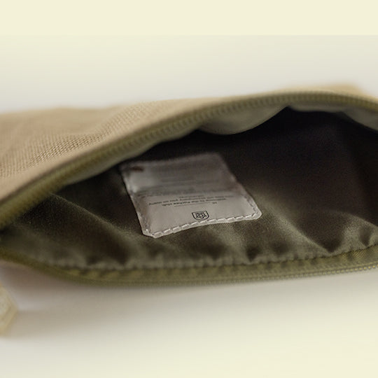 Neutral colour cotton pouch opened to reveal its interior and tag for Name and Contact details with Pachee welcome note.