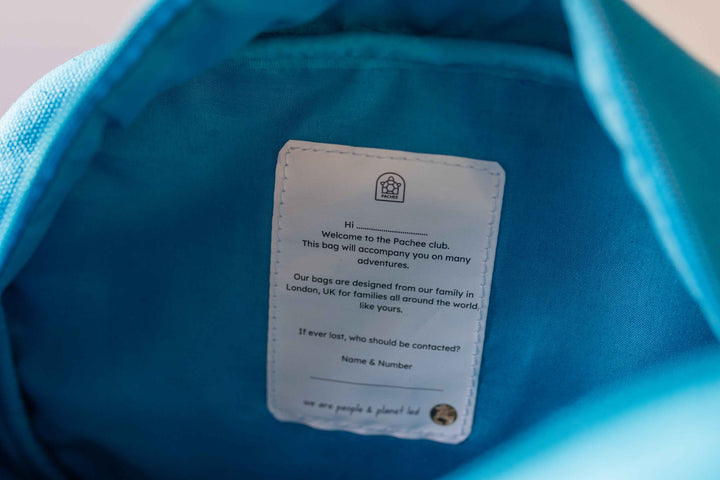 Blue Junior Backpack in an open view, displaying an interior label with 'Pachee' branding, available at Pachee online store.