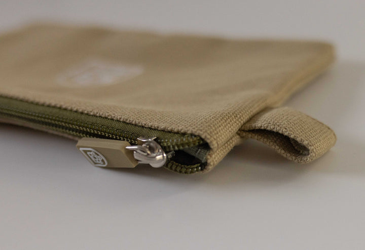 Canvas Neutral zipper pouch featuring a closed zipper and small holder, available at Pachee's online store in the UK.Neutral canvas zipper pouch featuring a closed zipper and small holder, available at Pachee's online store in the UK.