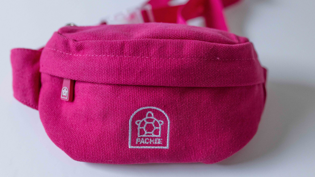 Front view of a stylish crossbody pink bum bag featuring the Pachee logo, perfect for a trendy look. Available online.