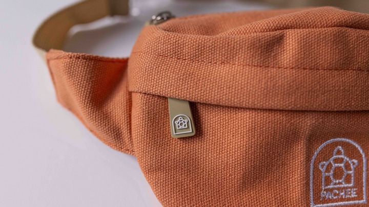 Focused view of a crossbody bum bag showcasing the high-quality material, sturdy zip, and Pachee logo, available at Pachee online store.