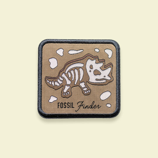 Fossil Finder patch featuring the phrase with a giraffe design.