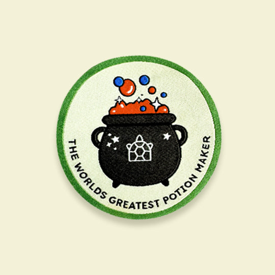 Halloween Witches Cauldron patch with the phrase "The World's Greatest Potion Maker" in bold lettering.