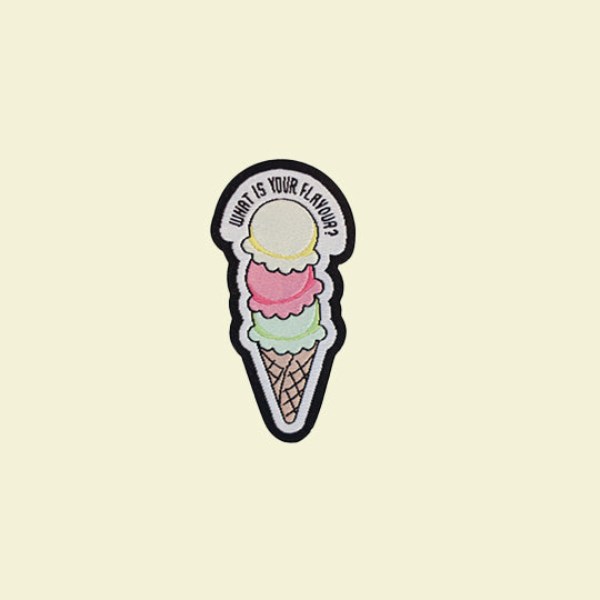 A colourful ice cream patch with the phrase "What is your flavour?" displayed on it.