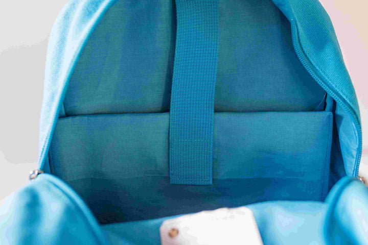 Blue Junior backpack in an open view displaying a dedicated laptop/iPad pocket, available at Pachee online store.