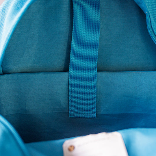 Blue Junior Laptop backpack in an open view displaying a dedicated laptop/iPad pocket, available at Pachee online store.