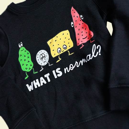 Black sweatshirt for kids with "What is Normal" statement in white font, featuring funny designs, made from organic cotton.
