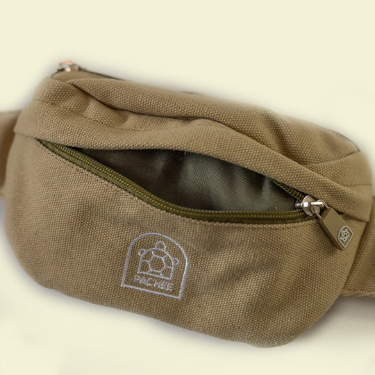 Kids neutral bum bag with front compartment open, featuring quality zip stitching and Pachee logo in front.
