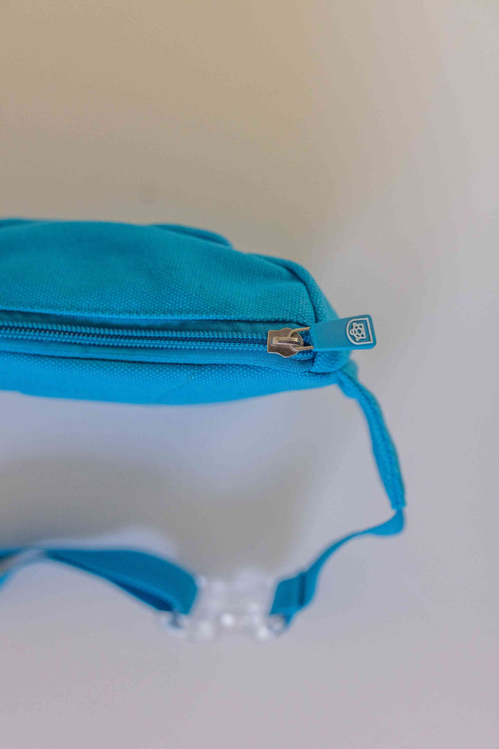 Top view of a high-quality bum bag with a smooth zipper, showcasing its stylish design and durable fabric.
