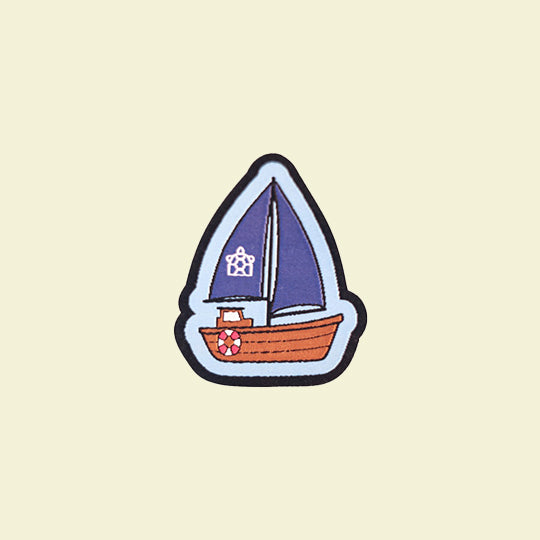 Sail boat patch featuring a detailed design of a sailboat with vibrant colours, perfect for nautical enthusiasts.