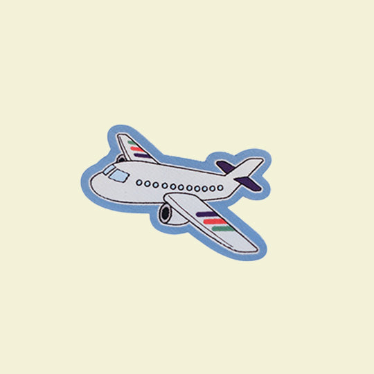 Travel aeroplane patch featuring a stylised airplane design, ideal for adding a travel-themed touch to clothing.