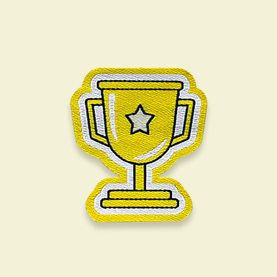 Trophy reward patch, featuring a gold trophy symbol on a fabric patch with a detailed design.