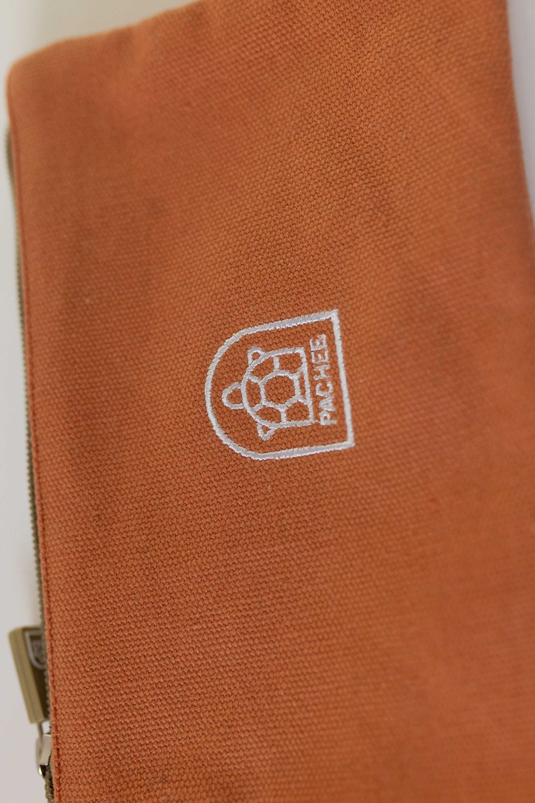 Waterproof orange pouch displayed prominently, ideal for protecting belongings. Available online at Pachee in the UK.